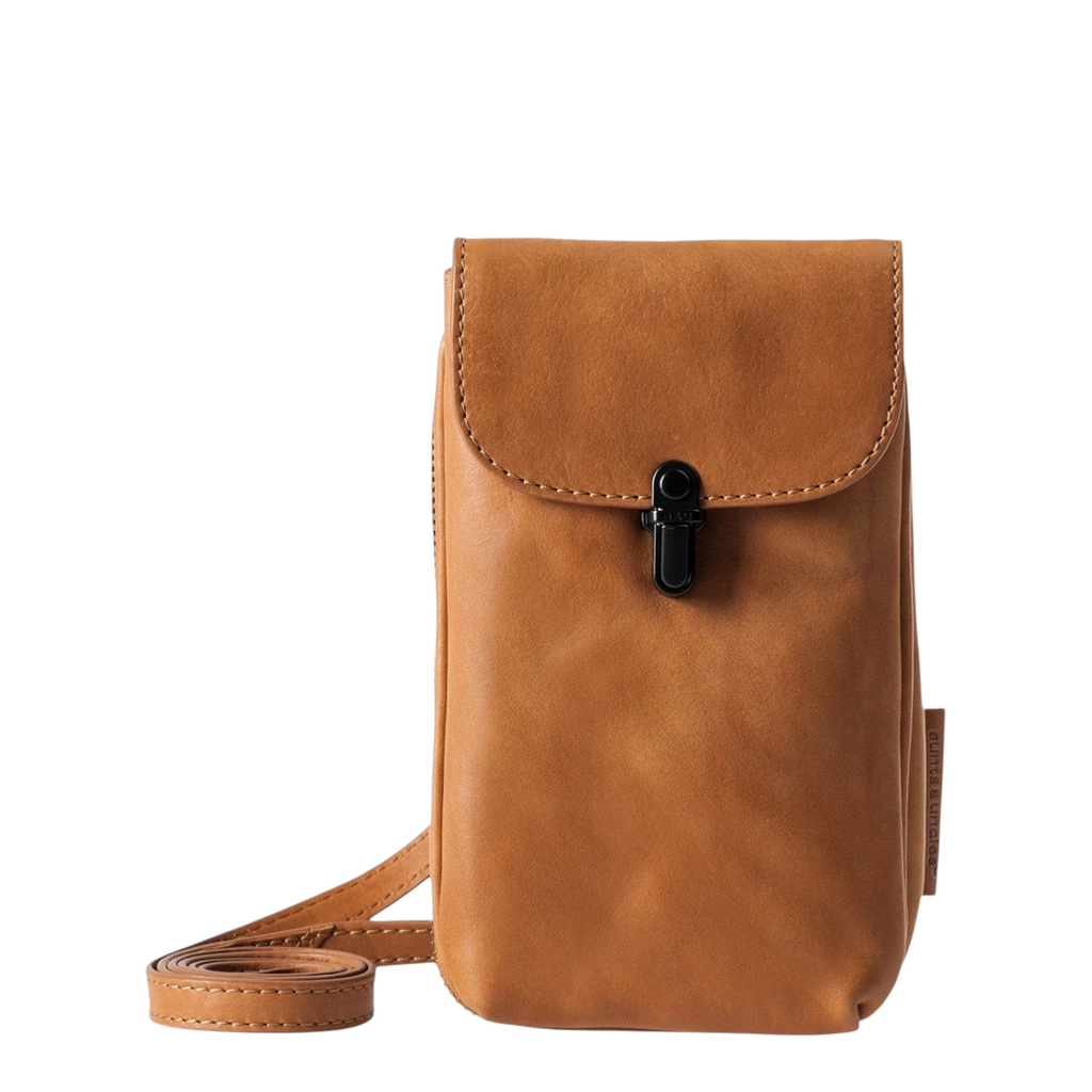 Lieblingstasche Mrs. Lemon Twist phone bag in tan leather with a black clasp closure and adjustable shoulder strap.