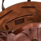 Lieblingstasche brown leather drawstring bucket bag with interior zip pocket and leather logo patch.