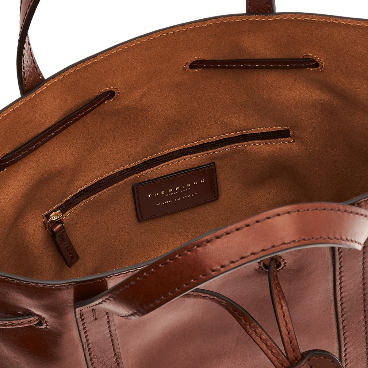 Lieblingstasche brown leather drawstring bucket bag with interior zip pocket and leather logo patch.