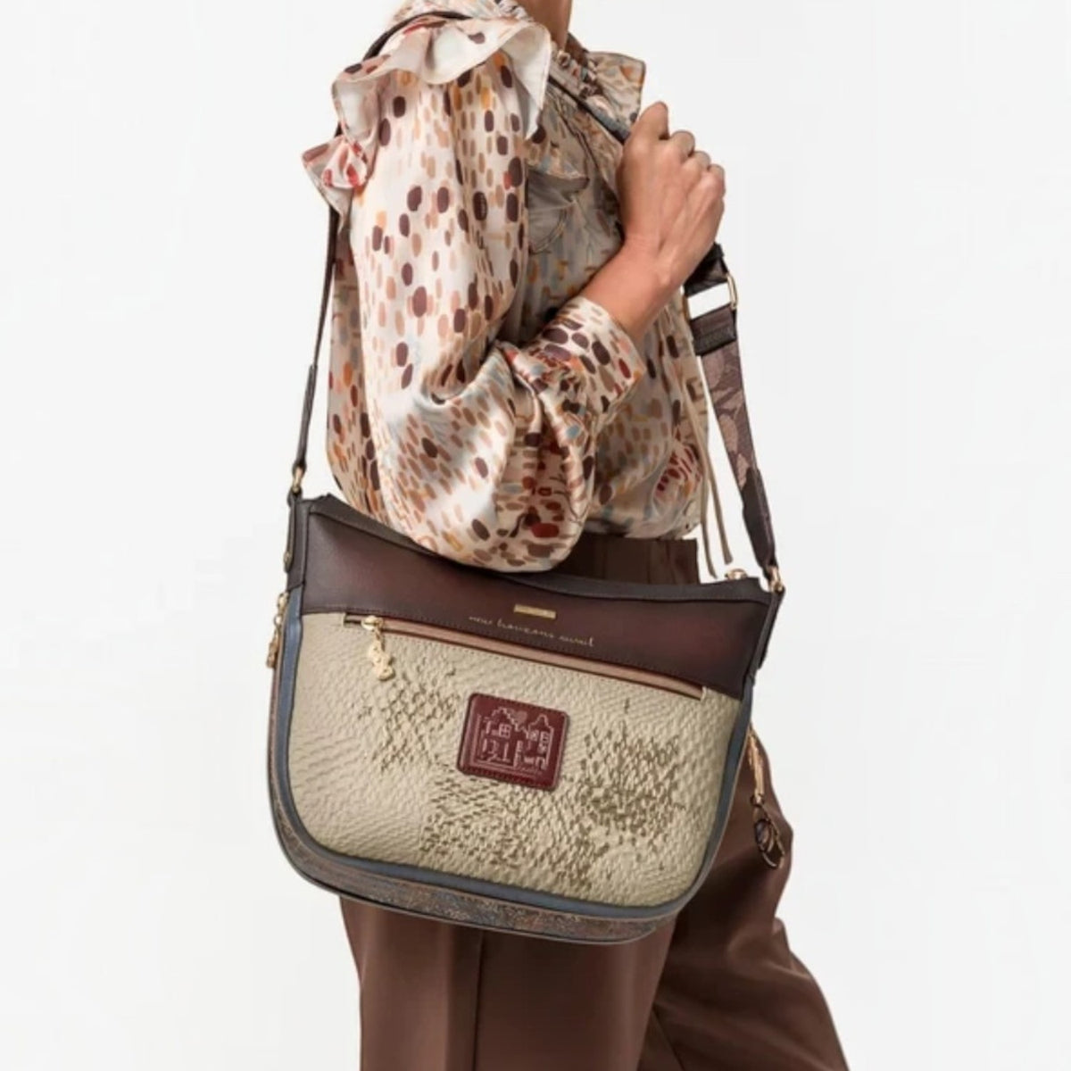 Lieblingstasche cross-body bag in beige and brown with textured patterns and a decorative logo patch