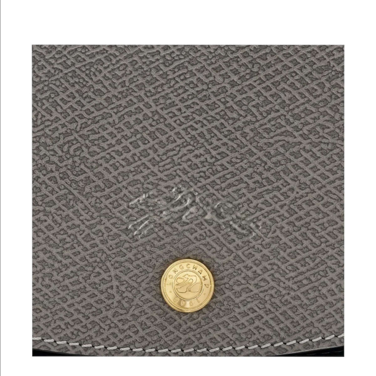 Lieblingstasche Epure grey leather handbag close-up with gold button detail and embossed logo