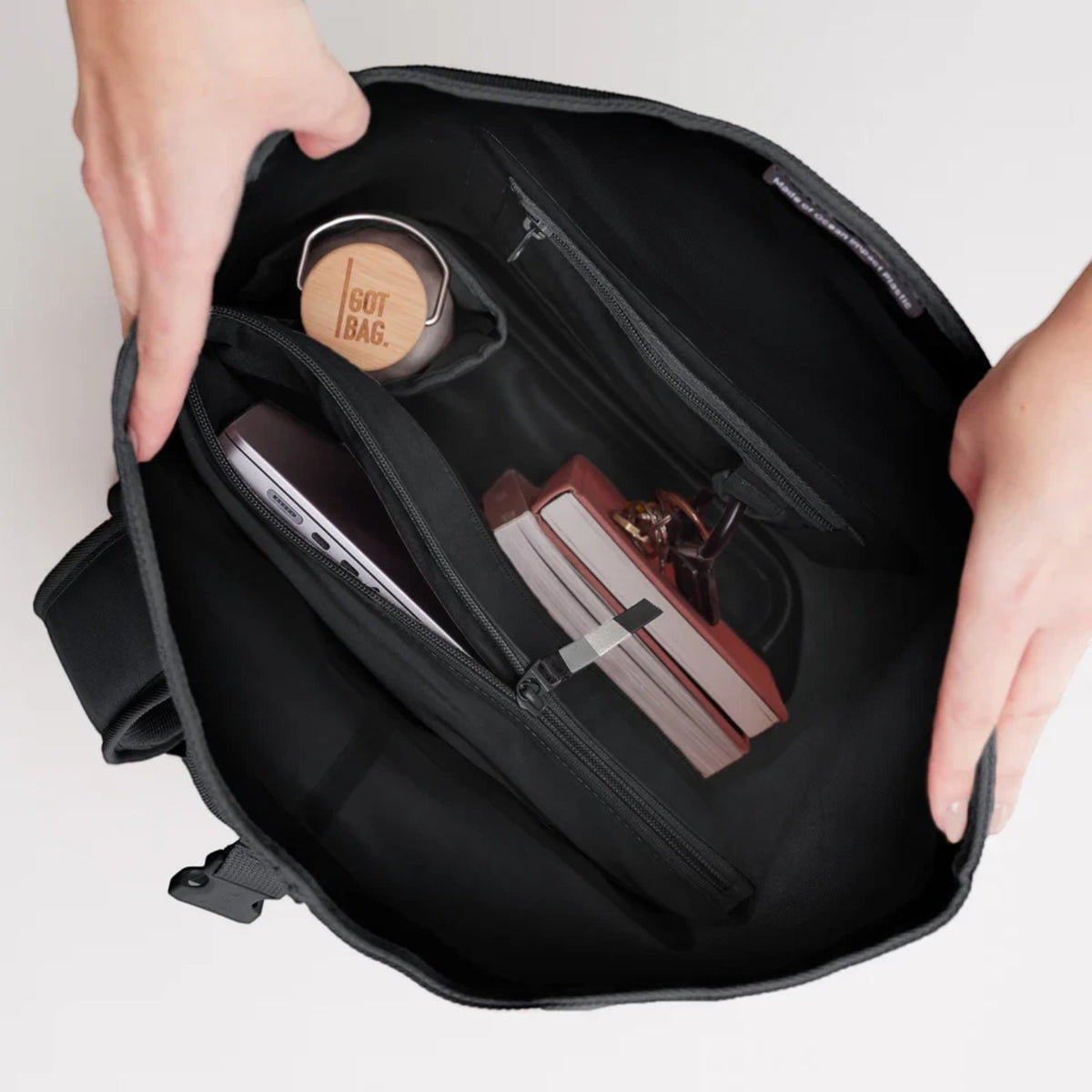 Lieblingstasche GOT BAG Rolltop Lite 2.0 backpack interior showing laptop sleeve, water bottle, and organized pockets