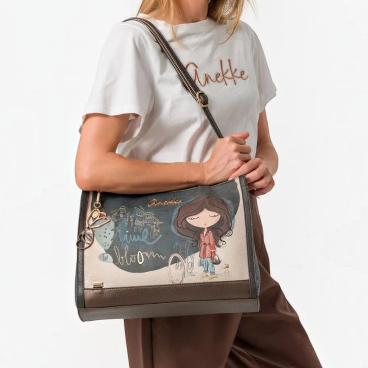 Lieblingstasche shoulder bag featuring a whimsical illustrated girl design with metallic accents and adjustable strap