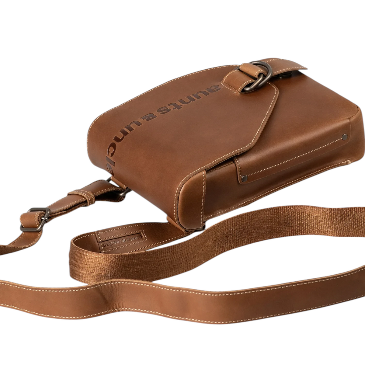 Lieblingstasche Jade brown leather crossbody bag with embossed logo and adjustable strap on white background