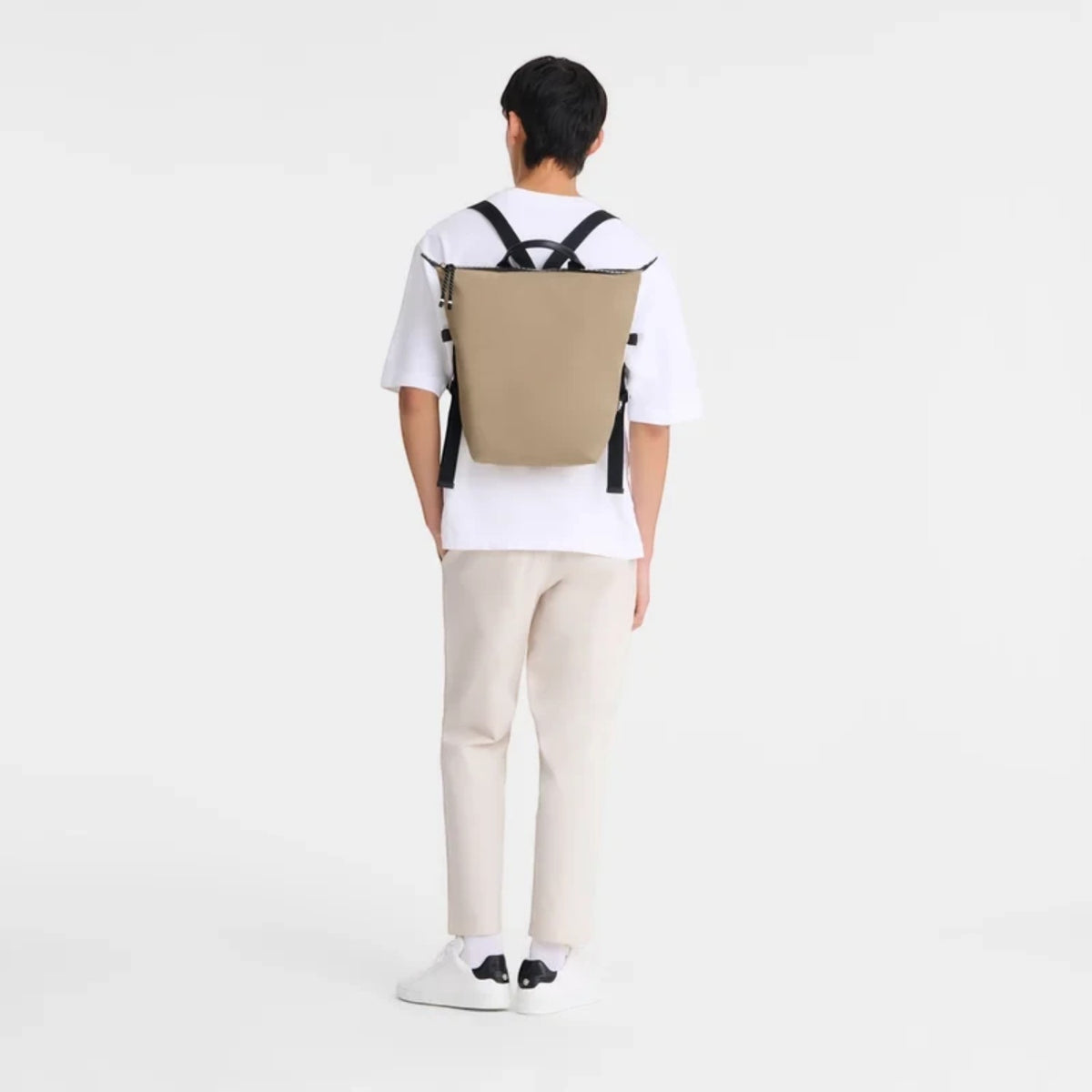 Lieblingstasche Le Pliage Energy Rucksack in tan recycled nylon with adjustable straps. Modern, minimalist style.