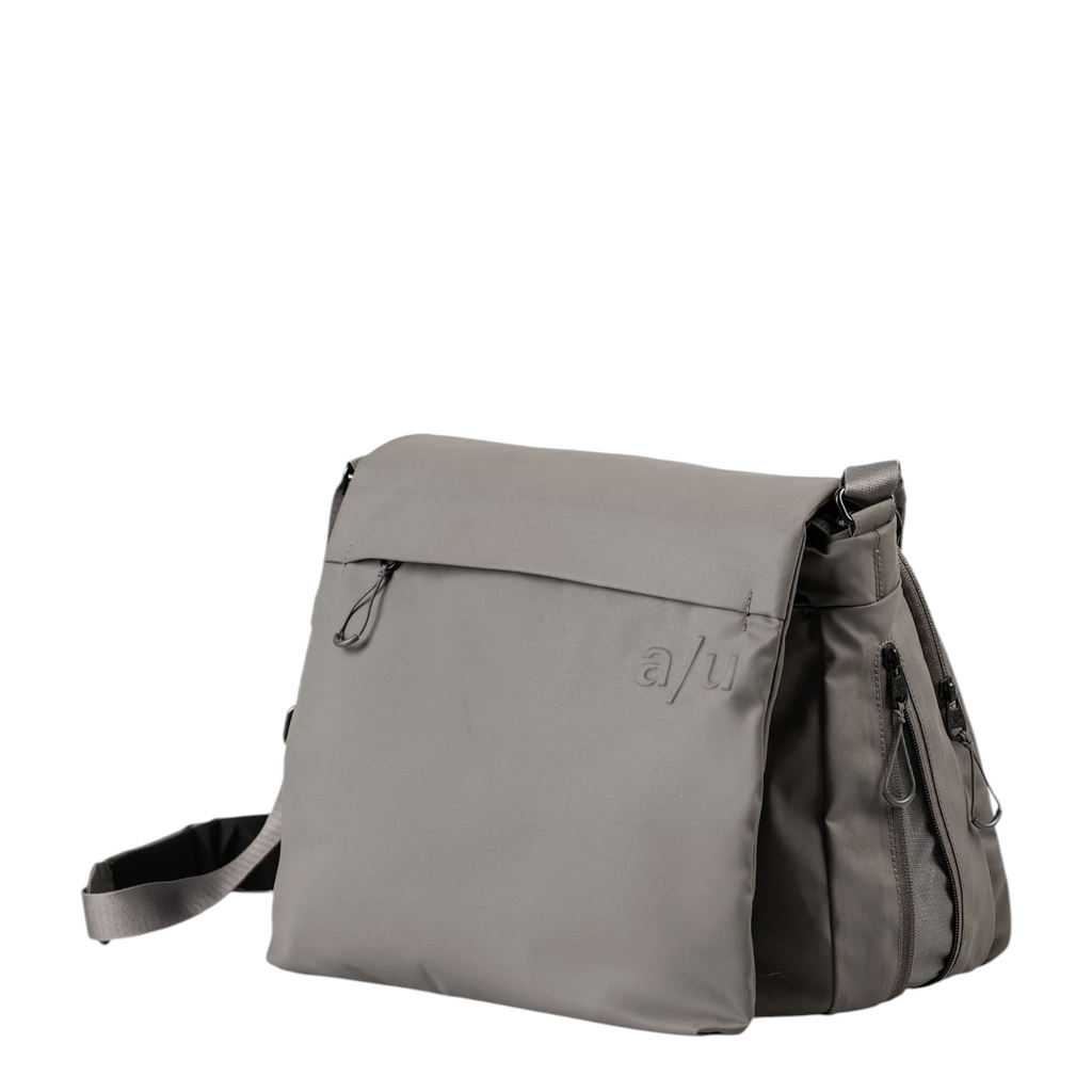 Lieblingstasche Midori RE lite grey messenger bag with a flap closure and minimalist logo detail