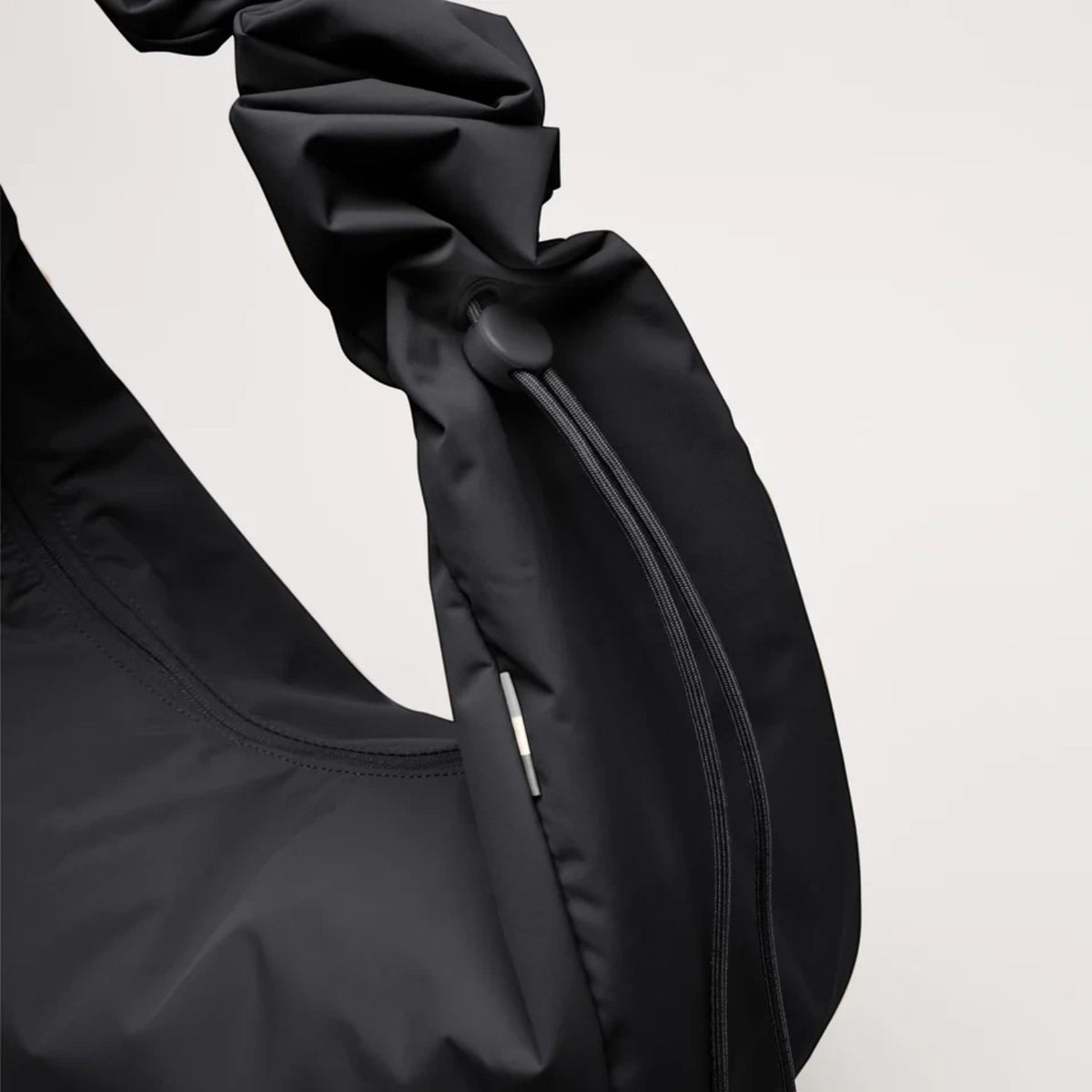 Lieblingstasche Moon Bag Ruffle Large in black made from sustainable recycled fishing nets with a gathered strap