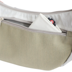 Lieblingstasche Roop L bag featuring a beige canvas exterior, white trim, and a zippered pocket with a small tag.