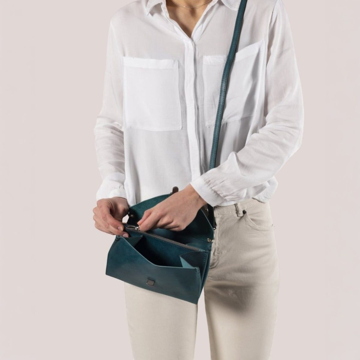 Lieblingstasche teal leather fold handbag clutch with zipper and strap.